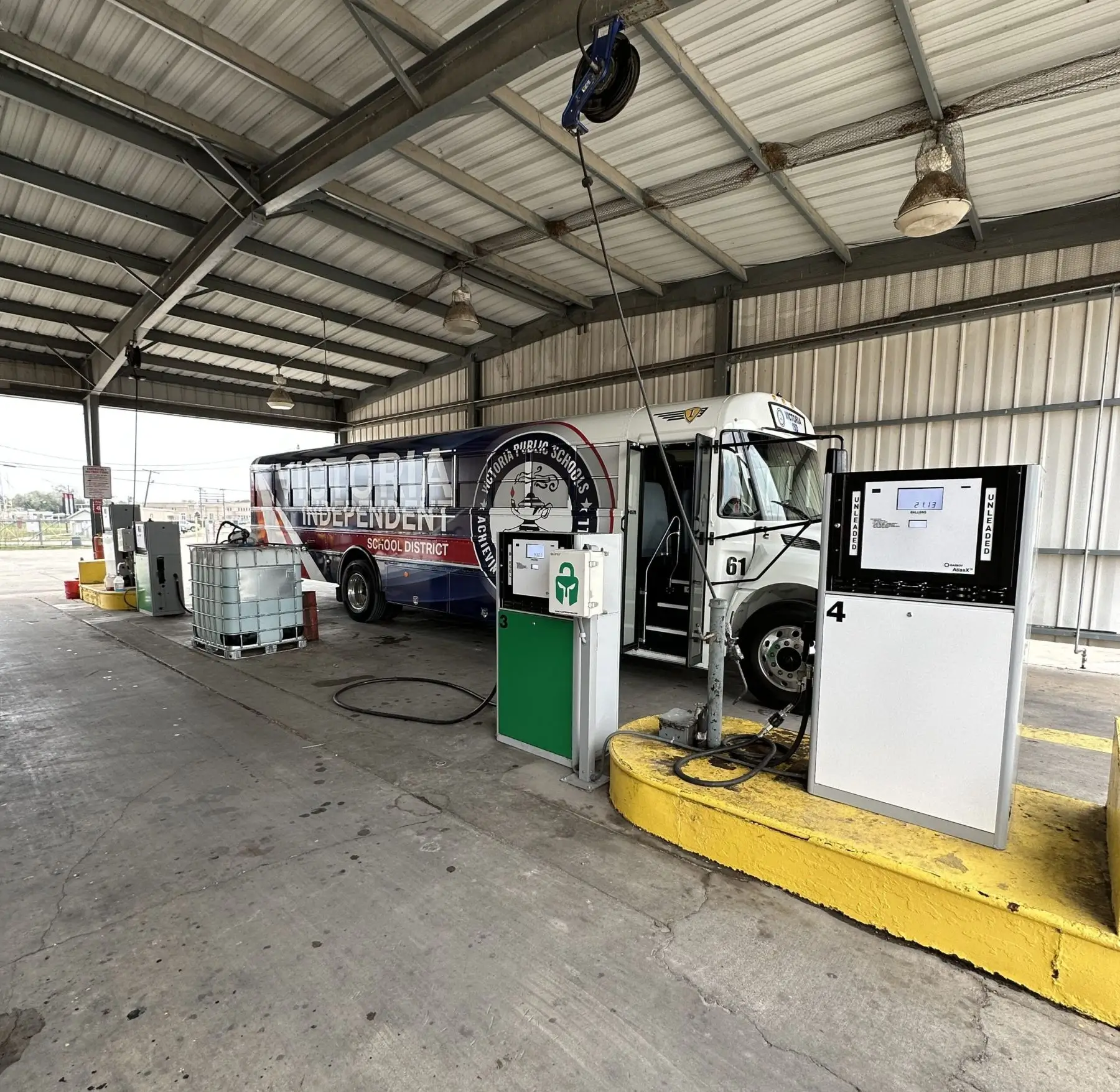 Bus refueling at a covered station.